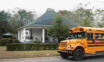 Tour bus by Richard Williams’ home, 310 Magnolia St.